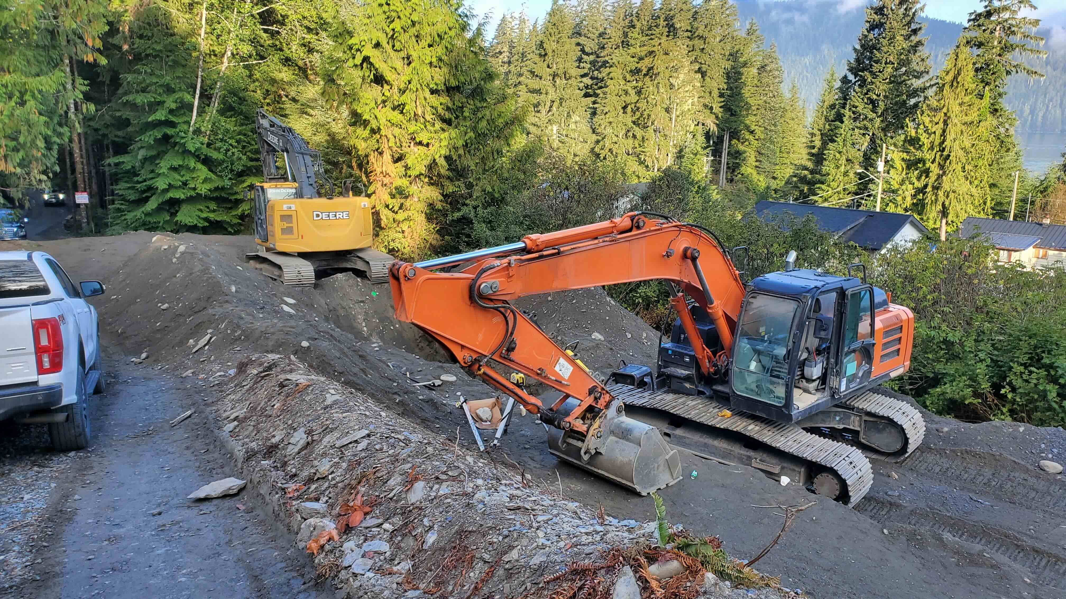 Construction Machinery at Work on Port Renfrew's New Watermain Extension Site